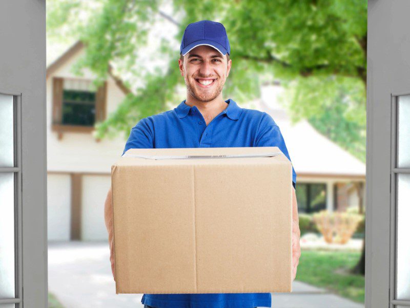 A man holding a box in his hands.