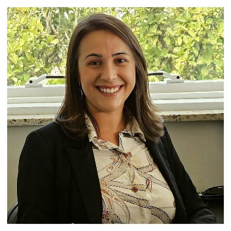 A woman in a black jacket and white shirt